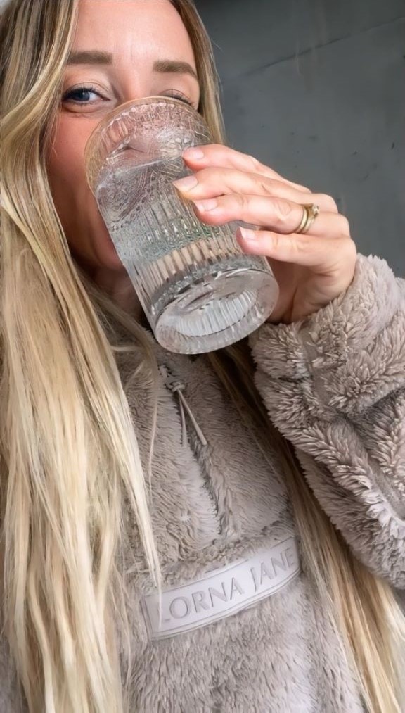 Rebecca Gawthorne drinking a glass of water